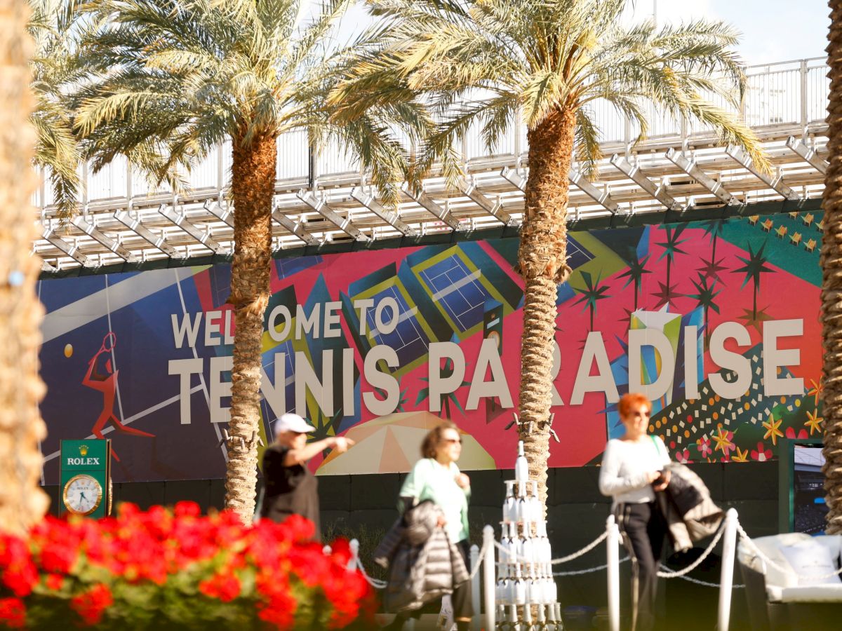 The image shows a colorful sign that reads 