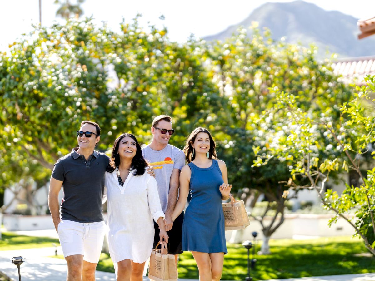 Friends walking the resort grounds with Coachella Valley mountain views